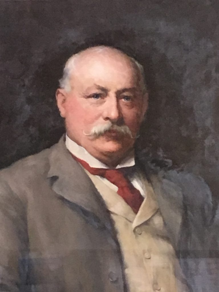 Portrait of Harry Simpson Gee, with a plaque saying "Presented by the Shareholders of the Leicestershire Banking Company Ltd to Harry Simpson Gee Esq in recognition of his long services as Director and Chairman.