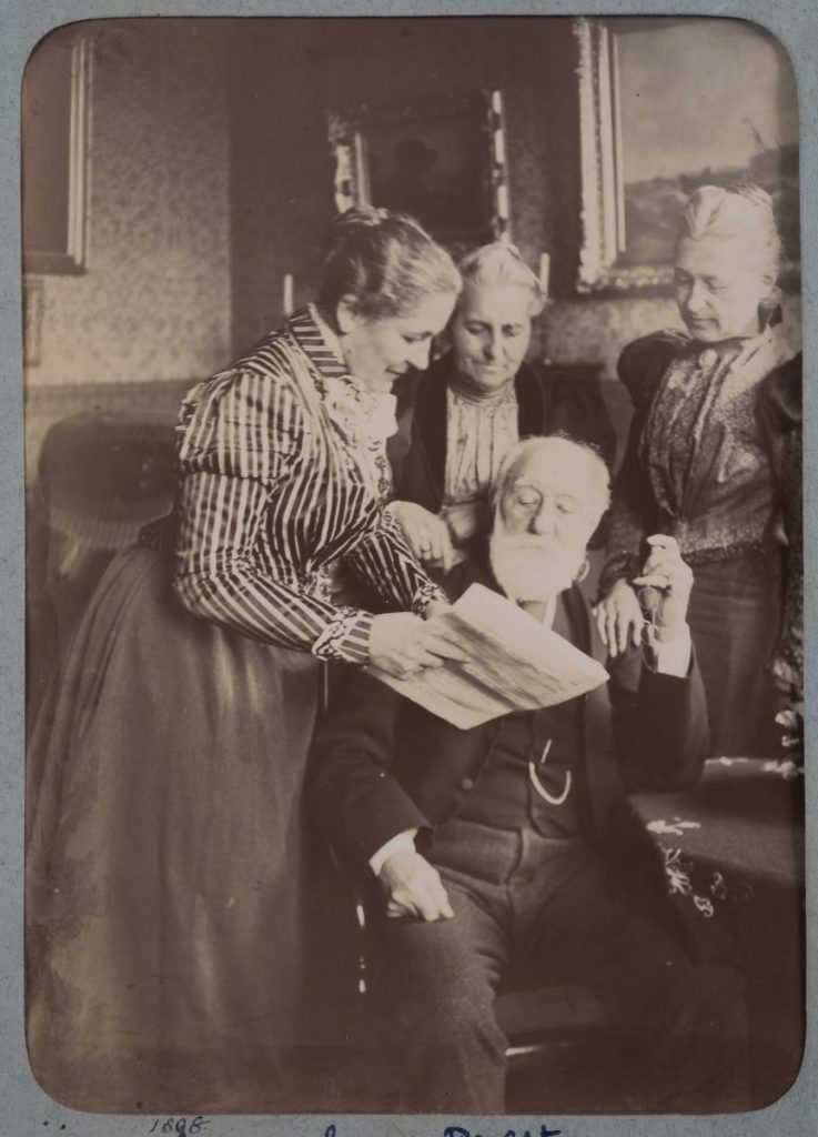 Black and white photograph of Mabel Bruce's sisters, Lizzie, Louise and Clara, and her father, Alfred Paget.