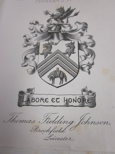 Photograph of Thomas Fielding Johnson's book plate showing his coat-of-arms