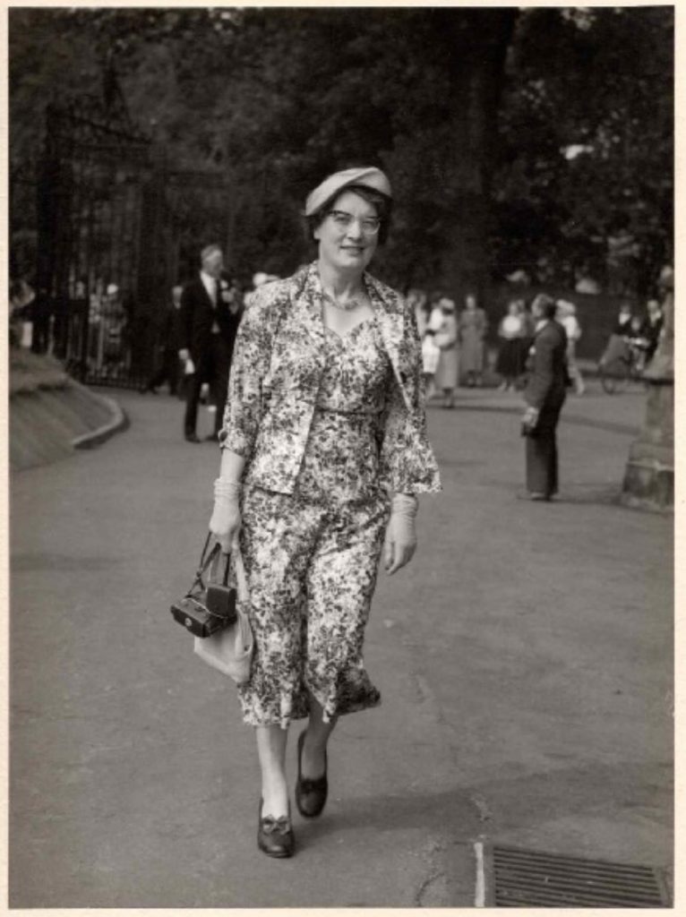 Black and white photograph of Mabel Towle attending a family wedding, 1958