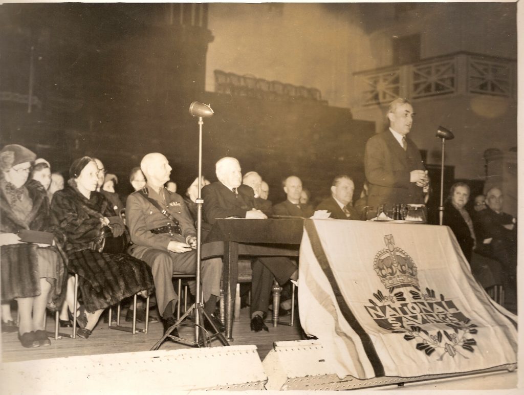 Black and white photograph of Percy Gee at the de Montfort Hall National Savings event